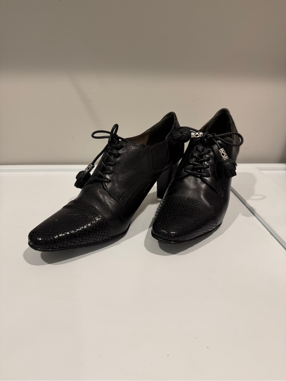 Brighton Black Leather Lace-Up Heeled Oxfords with Tassel Accents